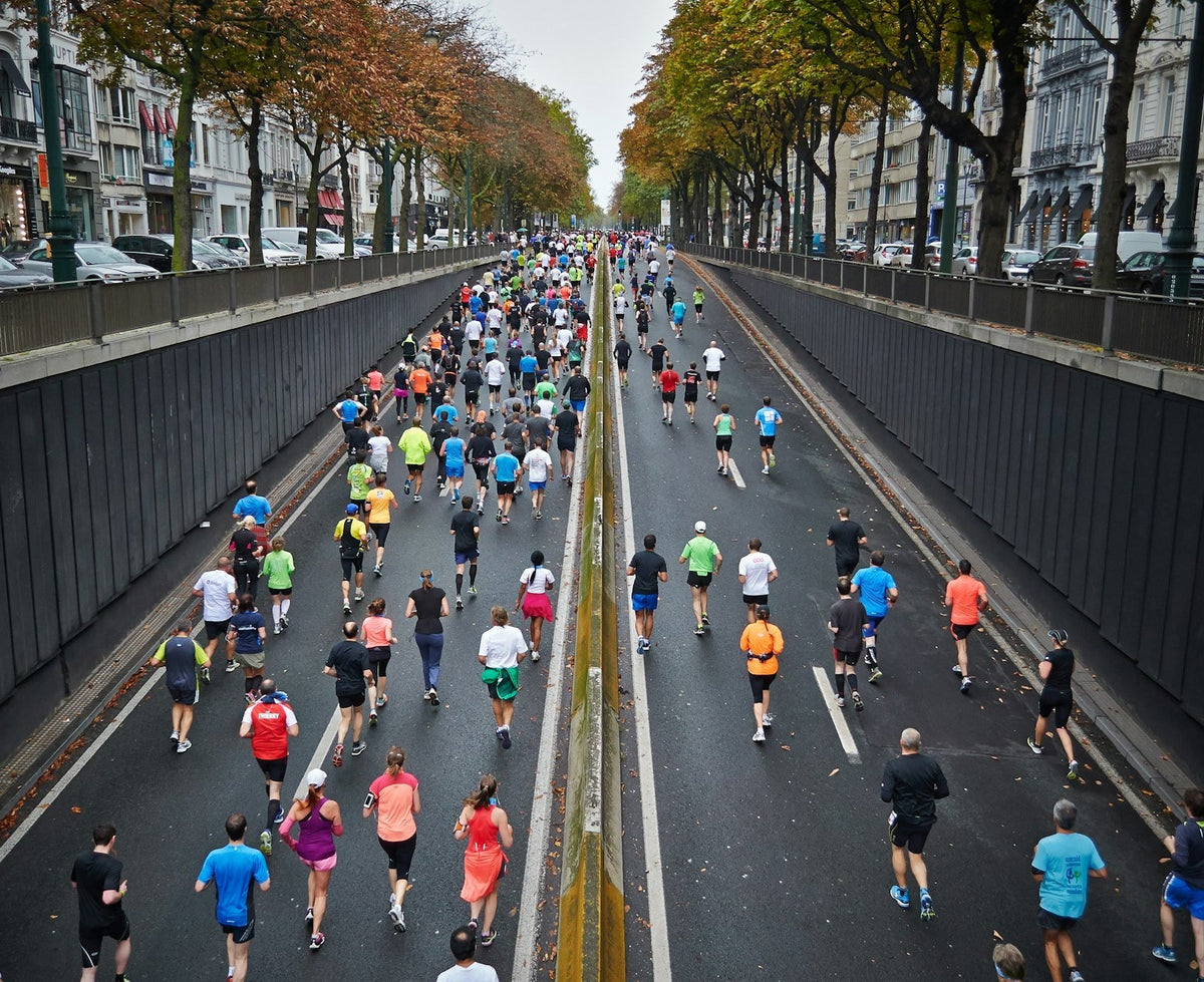 Marathon runners on a city avenue