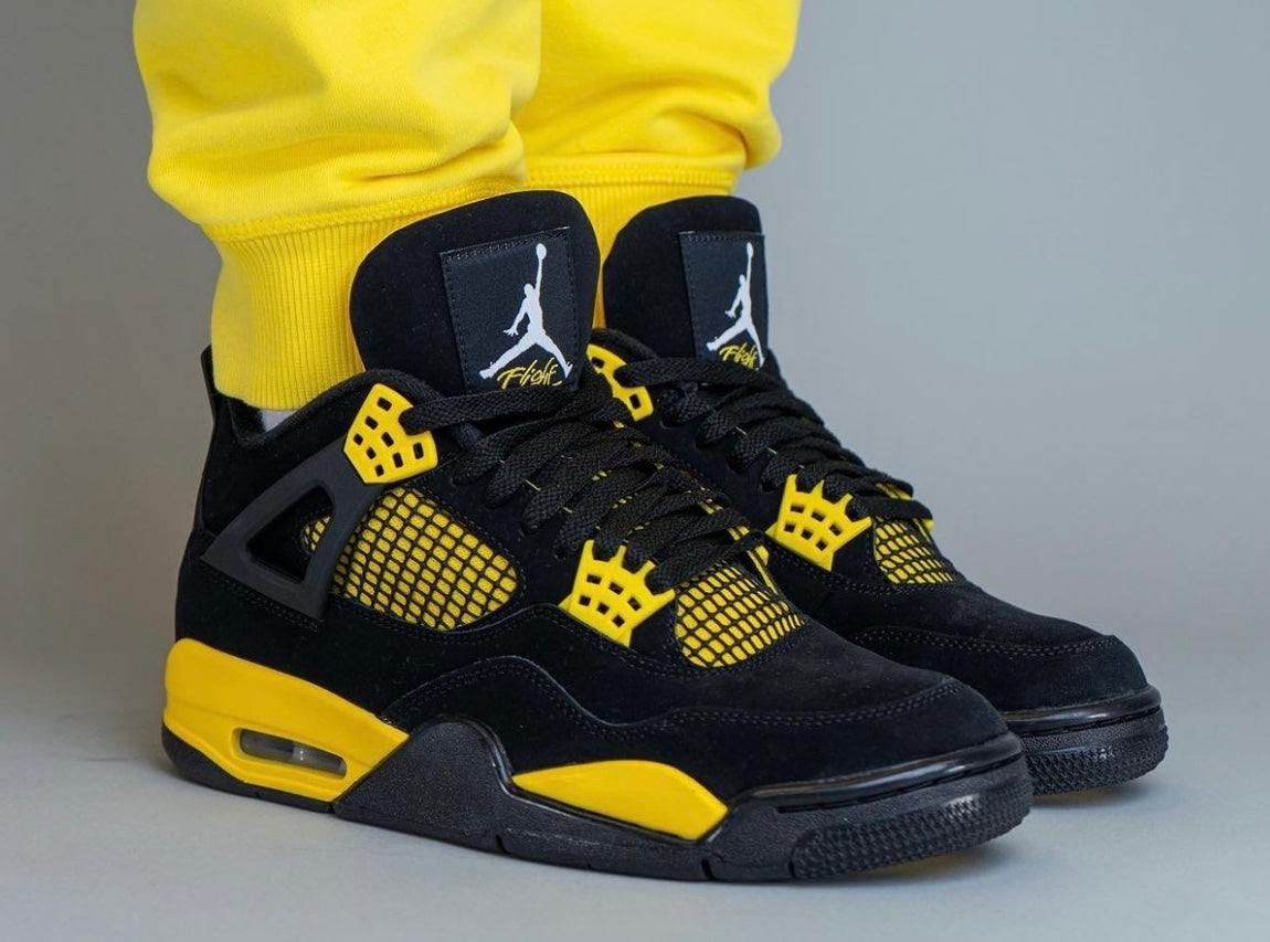 Air Jordan 4 Retro Thunder worn on feet
